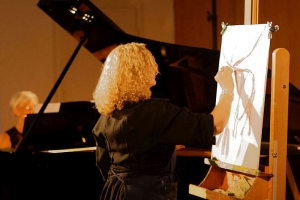 « En solo ou accompagnée de notes musicales livrées par la magnificence du piano tenue par Marie-Hélène PAUVERT, Véronique FANTI a régalé le public en nous dévoilant les immenses facettes de son travail pictural… ».